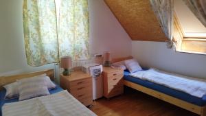 Postel nebo postele na pokoji v ubytování Eszter-lak