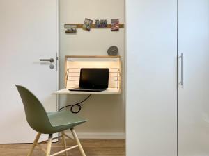 TV a/nebo společenská místnost v ubytování Am Kutterhafen 26 - Nordsee-Loft