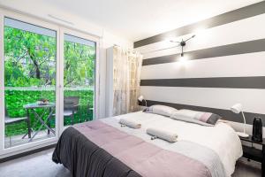 Ένα ή περισσότερα κρεβάτια σε δωμάτιο στο GuestReady - Bliss and Peace near Paris