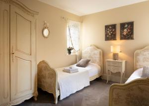 a bedroom with two beds and a window at Luxury Interior Designed 4 Bedroom Villa, Kenmare in Kenmare