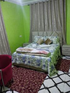 מיטה או מיטות בחדר ב-Villas khadija