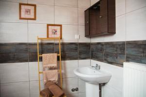 a bathroom with a sink and a toilet and a sink at Adamou Family House in Prinos +24 photos
