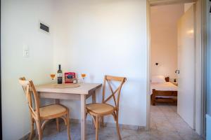 Postel nebo postele na pokoji v ubytování One House Pythagoreio