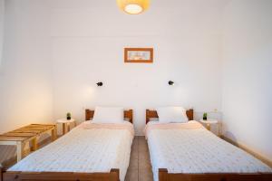 Postel nebo postele na pokoji v ubytování One House Pythagoreio