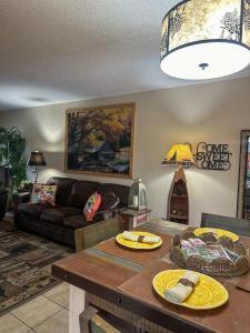 a living room with a couch and a table at River Place Condos #206 2BD in Pigeon Forge