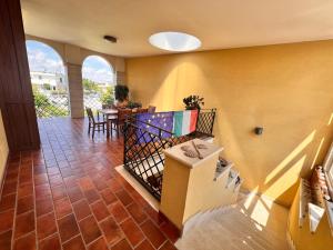 a living room with a staircase and a table at B&B La Rosa Blu in Bari