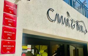a sign on the side of a pharmacy building at Corinthia St George's Bay in St. Julianʼs