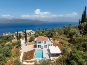an aerial view of a house with a swimming pool at Villa Stella in Nikiana