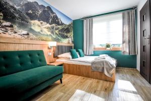 Posteľ alebo postele v izbe v ubytovaní Apartamenty Mrozówka