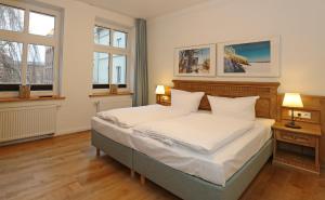 Łóżko lub łóżka w pokoju w obiekcie Aparthotel an Sankt Marien