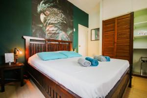 Letto o letti in una camera di Woodstock Palmresort Curaçao