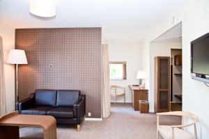 TV a/nebo společenská místnost v ubytování Montra Hotel Sabro Kro