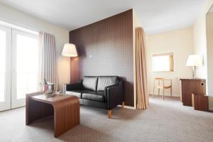 Posezení v ubytování Montra Hotel Sabro Kro
