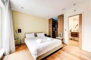 Voodi või voodid majutusasutuse GuestReady - Cosmopolitan Living in Central London toas
