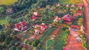 an aerial view of a house with red roofs at Greenhouse Retreat in Sen Monorom