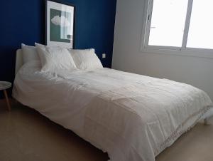 Postel nebo postele na pokoji v ubytování Alcudia Smir Apartment