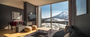 a living room with a view of a mountain at Terrazze in Kutchan