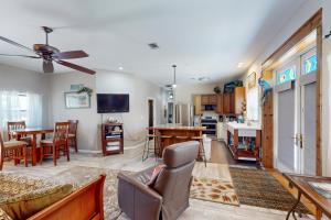 a living room with a couch and a table at Mermaid Haven in Mexico Beach