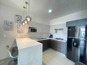 Η κουζίνα ή μικρή κουζίνα στο Beautiful apartment, BBQ, A.C, 5 min Arena, Gym