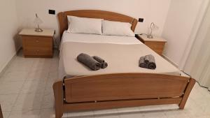 a bedroom with a large bed with two night stands at La Foggia seaside paradise in Siculiana