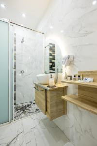 a bathroom with a sink and a shower at Palace Napoli in Naples +81 photos