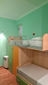 a room with two bunk beds in a room at La Foggia seaside paradise in Siculiana