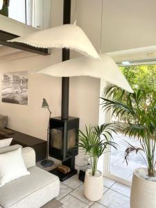 a living room with a fireplace and a couch at Jesolo Beach Villa in Lido di Jesolo