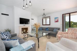 a living room with a couch and a table at Florida Home in Casares
