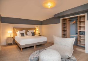 Postel nebo postele na pokoji v ubytování Hôtel Arcanse by Inwood Hotels