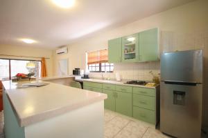 Kuchyň nebo kuchyňský kout v ubytování Woodstock Palmresort Curaçao