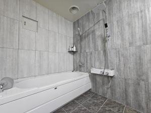 a bathroom with a bath tub and a shower at HOTEL ViA in Ansan +70 photos