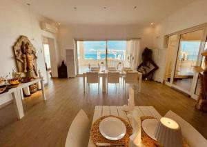 a living room with a table and a dining room at VILLA G&G CALABRIA in Campora San Giovanni