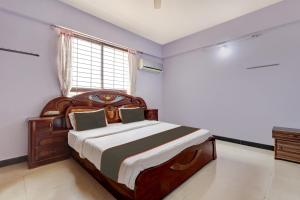 เตียงในห้องที่ Collection O KMM Kushi Resort