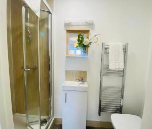 a bathroom with a sink and a shower at Endsleigh Park in Hull