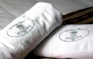 a towel that is laying on top of a bed at D'Angelo Palace Hotel in Mazara del Vallo
