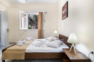 Ένα ή περισσότερα κρεβάτια σε δωμάτιο στο Tasoula Apartment with sea view 1