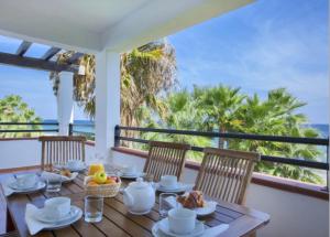 a dining table with a view of the ocean at Sognu di Rena privilege Top appartament view sea in San-Nicolao