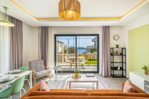 a living room with a couch and a table at Meri Suite Apart Kaş in Kas
