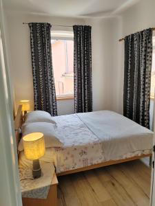 Postel nebo postele na pokoji v ubytování Apartments Ani