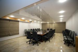 a conference room with a long table and chairs at Hotel Black Sea in Batumi