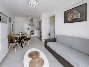 a living room with a couch and a table at Viking Family Superior Lux in Ayia Napa