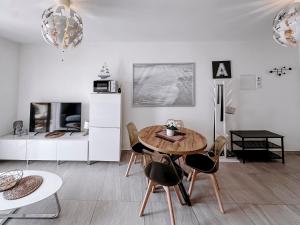 a living room with a table and chairs at Viking Family Superior Lux in Ayia Napa