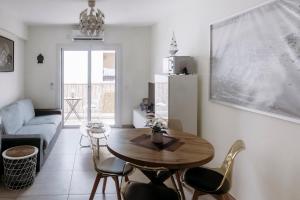 a living room with a table and chairs and a couch at Viking Family Superior Lux in Ayia Napa +15 photos