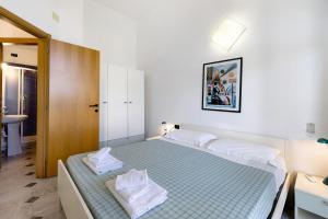 Postel nebo postele na pokoji v ubytování Pian Dei Boschi B3210 + 29 fotografií