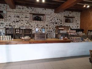 a counter in a store with a stone wall at Cabane - La Forest in Épuisay