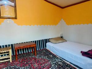Postel nebo postele na pokoji v ubytování Auberge L'Oasis Mhamid