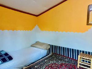 Postel nebo postele na pokoji v ubytování Auberge L'Oasis Mhamid