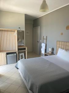 Postel nebo postele na pokoji v ubytování Rondo's Hotel