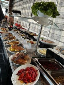a buffet line with many different types of food at Grand Hotel Van in Van