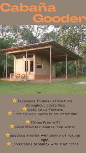 een poster van een kleine hut met een dak bij Cabina Gooder in Chachagua